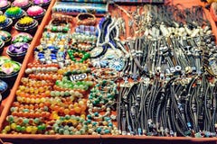 Leather bracelets,necklaces and other souvenirs at night market stock photos Leather bracelets,necklaces and other souvenirs at night market stock photos