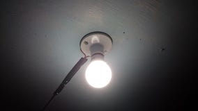 LED light bulb on ceiling. At night Stock Image LED light bulb on ceiling. At night Stock Image