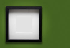Leerer starker Fotorahmen auf grüner Wand lizenzfreies stockbild Leerer starker Fotorahmen auf grüner Wand lizenzfreies stockbild