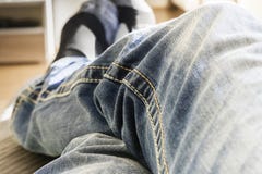 Legs in jeans on floor royalty free stock photography Legs in jeans on floor royalty free stock photography