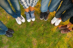 Legs and sneakers of teenage boys and girls stock images Legs and sneakers of teenage boys and girls stock images