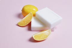 Lemon soap for washing and bleaching things on a pink background stock photos Lemon soap for washing and bleaching things on a pink background stock photos