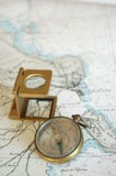 Lens And Compass On A Map ! Stock Image