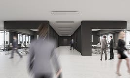 Les gens marchant dans le bureau avec le noir et les murs de verre Images stock Les gens marchant dans le bureau avec le noir et les murs de verre Images stock
