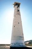 Leuchtturm und Meer in der Hintergrundbeleuchtung der Sonne lizenzfreie stockbilder Leuchtturm und Meer in der Hintergrundbeleuchtung der Sonne lizenzfreie stockbilder