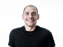 Leutegefühle und Gesichtsausdrücke Porträt des komischen jungen Mannes mit lustigem verrücktem glücklichem Gesicht stockfotografie Leutegefühle und Gesichtsausdrücke Porträt des komischen jungen Mannes mit lustigem verrücktem glücklichem Gesicht stockfotografie