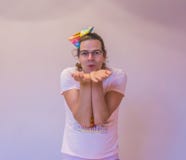 LGBT funny gender person making a blow kiss gesture close up isolation stock photo LGBT funny gender person making a blow kiss gesture close up isolation stock photo