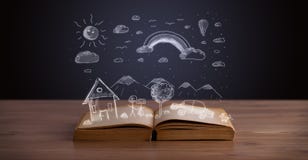 Libro aperto con paesaggio disegnato a mano fotografia stock Libro aperto con paesaggio disegnato a mano fotografia stock