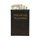 Libro nero e soldi con la pianificazione finanziaria dell'iscrizione su fondo bianco fotografia stock libera da diritti Libro nero e soldi con la pianificazione finanziaria dell'iscrizione su fondo bianco fotografia stock libera da diritti