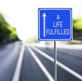 A Life Fulfilled Road Sign on a Speedy Background. royalty free stock photos A Life Fulfilled Road Sign on a Speedy Background. royalty free stock photos