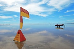 Lifeguard Flag At Murawhai Beach Royalty Free Stock Image