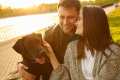 Lifestyle, happy family resting at picnic in the park with a dog stock images Lifestyle, happy family resting at picnic in the park with a dog stock images