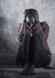 Lifestyle Indoors Portrait Of Young Sad And Depressed Black African American Woman Sitting At Home Floor Feeling Desperate And Stock Images