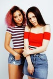 Lifestyle People Concept: Two Pretty Stylish Modern Hipster Teen Girl Having Fun Together, Diverse Nation Mixed Races Royalty Free Stock Photos