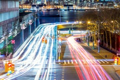 Light trails on the busy night streets, crossroad in big city Stock Photo Light trails on the busy night streets, crossroad in big city Stock Photo