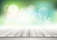 Wooden table against a bokeh lights background Stock Photography Wooden table against a bokeh lights background Stock Photography