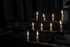 Burning candles in a dark stock photo Burning candles in a dark stock photo