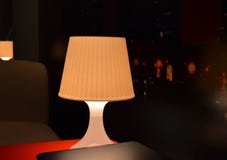 Lighted lamp on the red table royalty free stock photos Lighted lamp on the red table royalty free stock photos