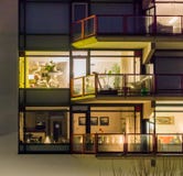 Lighted windows with balconies, typical city life in the Netherlands, Dutch architecture at night stock photography Lighted windows with balconies, typical city life in the Netherlands, Dutch architecture at night stock photography