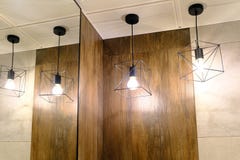 Lighting of the toilet. Pendant lamps are reflected in the mirror royalty free stock photo Lighting of the toilet. Pendant lamps are reflected in the mirror royalty free stock photo