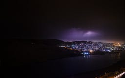 Lightning with dramatic clouds. Night thunder-storm over the mountain and the lake in Baku, Azerbaijan Stock Photo Lightning with dramatic clouds. Night thunder-storm over the mountain and the lake in Baku, Azerbaijan Stock Photo