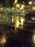 The lights of the night city through the wet glass. Abstract view. stock images The lights of the night city through the wet glass. Abstract view. stock images
