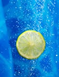 Lime In A Water Splash Stock Photo