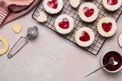Linzer cookies in shape of heart with jam on light. Mother\'s, Women\'s, Valentine\'s day. Homemade present.
