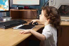 Little 2 3 Year Old Baby Girl In White Clothers Draws At The Home Computer In Graphics Drawing Tablet. Two Monitors. The Child Is Stock Photos