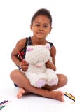 Little African Asian girl drawing Royalty Free Stock Photography Little African Asian girl drawing Royalty Free Stock Photography