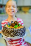 Little beautiful smiling girl with big cake stock image Little beautiful smiling girl with big cake stock image