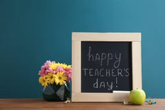 Little blackboard with inscription HAPPY TEACHER`S DAY