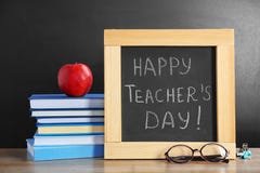 Little blackboard with inscription HAPPY TEACHER`S DAY