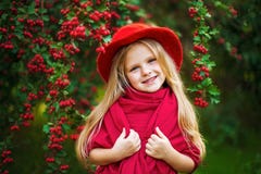 Young beautiful little stylish girl in a sunny autumn park royalty free stock images Young beautiful little stylish girl in a sunny autumn park royalty free stock images