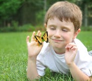 Little Boy Catching Spring Butterfly Outside Royalty Free Stock Photos Little Boy Catching Spring Butterfly Outside Royalty Free Stock Photos