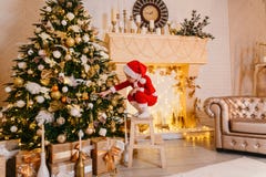 The little boy decorates a Christmas tree royalty free stock photos The little boy decorates a Christmas tree royalty free stock photos