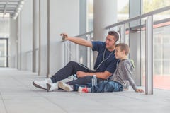 Little boy and his trainer taking a break and making selfie stock images Little boy and his trainer taking a break and making selfie stock images