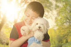 Little boy hugging his dog on the park Stock Photo Little boy hugging his dog on the park Stock Photo
