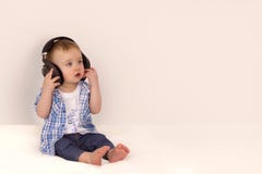 Little boy listening to music on headphones royalty free stock photos Little boy listening to music on headphones royalty free stock photos