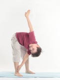 Little boy performs an exercise to stretch the muscles.isolated on white royalty free stock photos Little boy performs an exercise to stretch the muscles.isolated on white royalty free stock photos