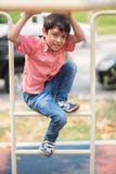 Little boy playing at playground climbing stock image Little boy playing at playground climbing stock image