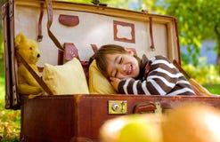 Little Boy Sleeps In A Large Suitcase In The Autumn Park Stock Photography