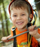 Little boy smiling in adventure park