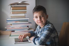Little boy is using a tablet. stock image Little boy is using a tablet. stock image
