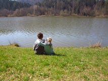 Little brother and sister by the lake royalty free stock photo Little brother and sister by the lake royalty free stock photo