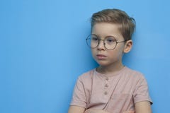 Little cute boy in glasses posing thoughtfully stock image Little cute boy in glasses posing thoughtfully stock image