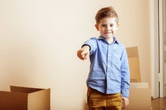 Little Cute Boy In Empty Room, Remoove To New House. Home Alone Emong Boxes Close Up Kid Royalty Free Stock Images