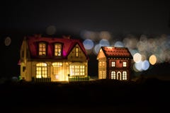 Little decorative houses, beautiful festive still life, cute small houses at night, Night city real bokeh background, happy winter stock images Little decorative houses, beautiful festive still life, cute small houses at night, Night city real bokeh background, happy winter stock images