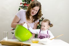 Little Girl And Mother Are Preparing Cookies Royalty Free Stock Photos