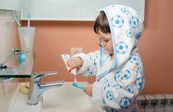 A little girl or child brushes teeth in the bathroom. Hygiene of the oral cavity. royalty free stock photos A little girl or child brushes teeth in the bathroom. Hygiene of the oral cavity. royalty free stock photos